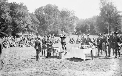 Lieutenant General Sir John Monash presenting decorations to members of the 4th Australian Infantry Brigade, after their success in the Battle of Hamel. Photo: (Public domain, via Wikimedia Commons), Times of Israel.