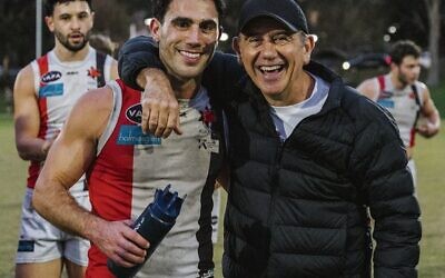 Nick Lewis (left) sharing his milestone moment with his dad Ronnie, a former AJAX president. 
Photos: Aaron Zajonc