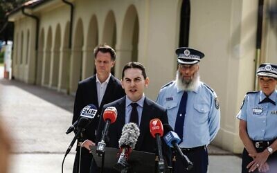 David Ossip at a press conference at Bondi Pavilion with (from left) Premier Chris Minns, Police chaplain Rabbi Mendel Kastel and former Police Commissioner Karen Webb.