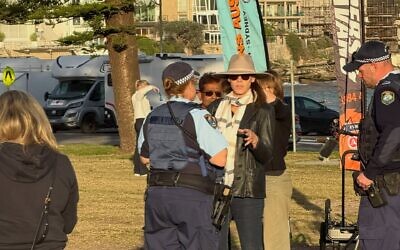 Police speaking to the woman at Archer Park last Wednesday. Photo: Facebook