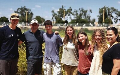 Doron Lazarus (second from left) with Israeli youth at the Adam v'Adama agricultural boarding school. Photo: Supplied