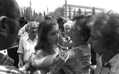 An emotional family reunion upon the return to Israel of the hostages from the Air France flight hijacked to Entebbe, Uganda, July 4, 1976. 
Photo: Israel Government Press Office