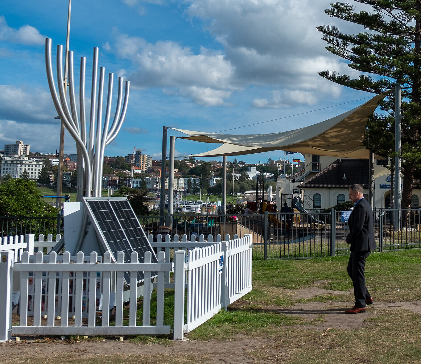 Itai Pessach pays his respects at the Bondi massacre memorial in Archer Park. Photo: Loretta Godfrey Itai Pessach pays his respects at the Bondi massacre memorial in Archer Park. Photo: Loretta Godfrey