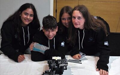 Handasaim High School students show off their robot.