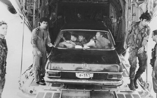 Commandos from Sayeret Matkal with a Mercedes they used to deceive the Ugandans. 
Photo: IDF Spokesman