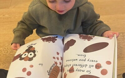 Carla's son Sunny reading Poo Party. Photo: supplied