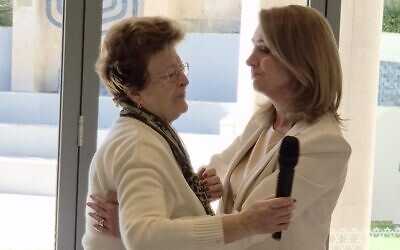 Larisa Kleytman (left) embraces NSW Opposition Leader Kellie Sloane.