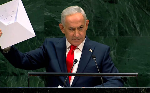 Prime Minister Benjamin Netanyahu holds a Starlink device during the 81st session of the United Nations General Assembly at United Nations headquarters, September 24, 2026. Photo: Screenshot/United Nations via YouTube