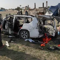 United Nations staff members inspect the remains of a car used by US-based aid group World Central Kitchen hit by an Israeli strike the previous day in Deir al-Balah in the central Gaza Strip on April 2, 2024. Photo: AFP/Times of Israel