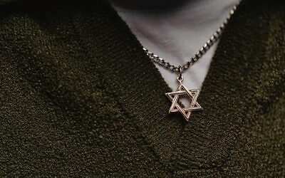 Staying in the fight for some may be simply wearing a Magen David.
Photo: Seventyfourimages | Dreamstime.com