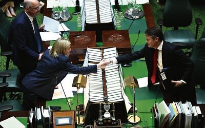 Premier Ben Carroll (right) shakes hands with Opposition Leader Jess Wilson before Question Time in the Legislative Assembly. Photo: AAP Image/James Ross