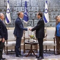 Israeli President Isaac Herzog (right) and ZFA president Jeremy Leibler shake hands at the President's Residence in Jerusalem. Photo: Facebook