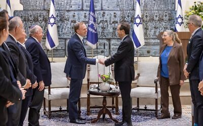 Israeli President Isaac Herzog (right) and ZFA president Jeremy Leibler shake hands at the President's Residence in Jerusalem. Photo: Facebook