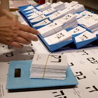 A worker weighs newly printed ballot papers, at a printing factory, ahead of the October 27 Israeli legislative election in Kiryat Gat, southern Israel, on October 8, 2026. Photo: Jack Guez/AFP