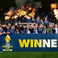 South Melbourne celebrate winning the 2026 Australia Cup final against Melbourne Victory at AAMI Park on October 10. 
Photo: AAP Image/Scott Barbour