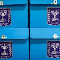 Workers prepare ballot boxes for the upcoming election at the Central Elections Committee warehouse in Shoham, ahead of their distribution to polling stations across the country, October 14, 2026. (Yonatan Sindel/Flash90)