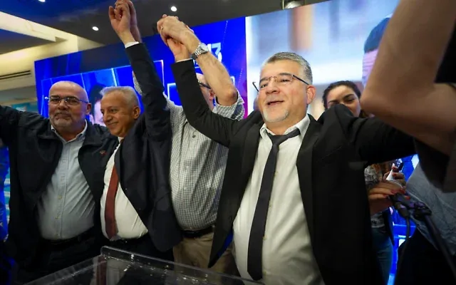 Joint List chair Yousef Jabareen and supporters gather at the party’s election headquarters in the northern Israeli city of Nazareth, following the closing of polling stations on election night, October 27, 2026. (Sharon Leibel/Flash90)