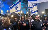 Activists celebrate at the Yashar party headquarters in Tel Aviv as early exit polls show the opposition bloc winning more seats. Photo: Matan Siegel/Times of Israel