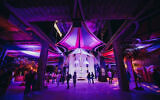 Visitors walk through the Nova Exhibition in Los Angeles, where immersive installations recreate the site of the 7 October massacre. Photo: Nova Exhibition
