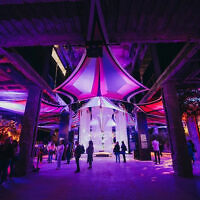 Visitors walk through the Nova Exhibition in Los Angeles, where immersive installations recreate the site of the 7 October massacre. Photo: Nova Exhibition