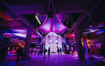 Visitors walk through the Nova Exhibition in Los Angeles, where immersive installations recreate the site of the 7 October massacre. Photo: Nova Exhibition