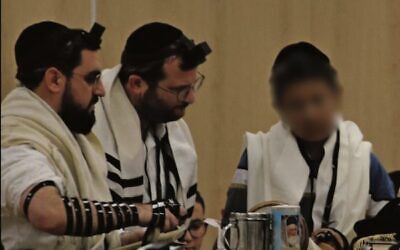 Uriel called to the Torah with his teacher, Rabbi Yosef Chaim. 
Photo: Supplied