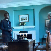 Frances Munning, played by Penny Downie in The Diplomat, in a tribute scene to the late Hersh Goldberg-Polin in season four, tells an anecdote to Stuart Heyford, played by Ato Essandoh Photo: Screenshot