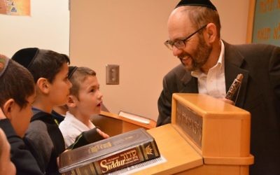 Torah Day School pupils study with sofer Rabbi Ariel Asa.