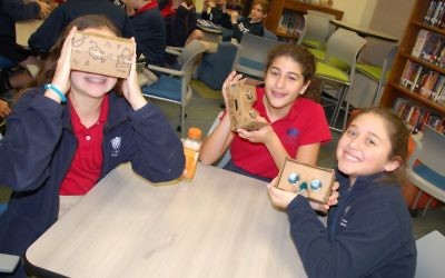 Davis Academy middle-schoolers test out the Google Cardboard viewer.
