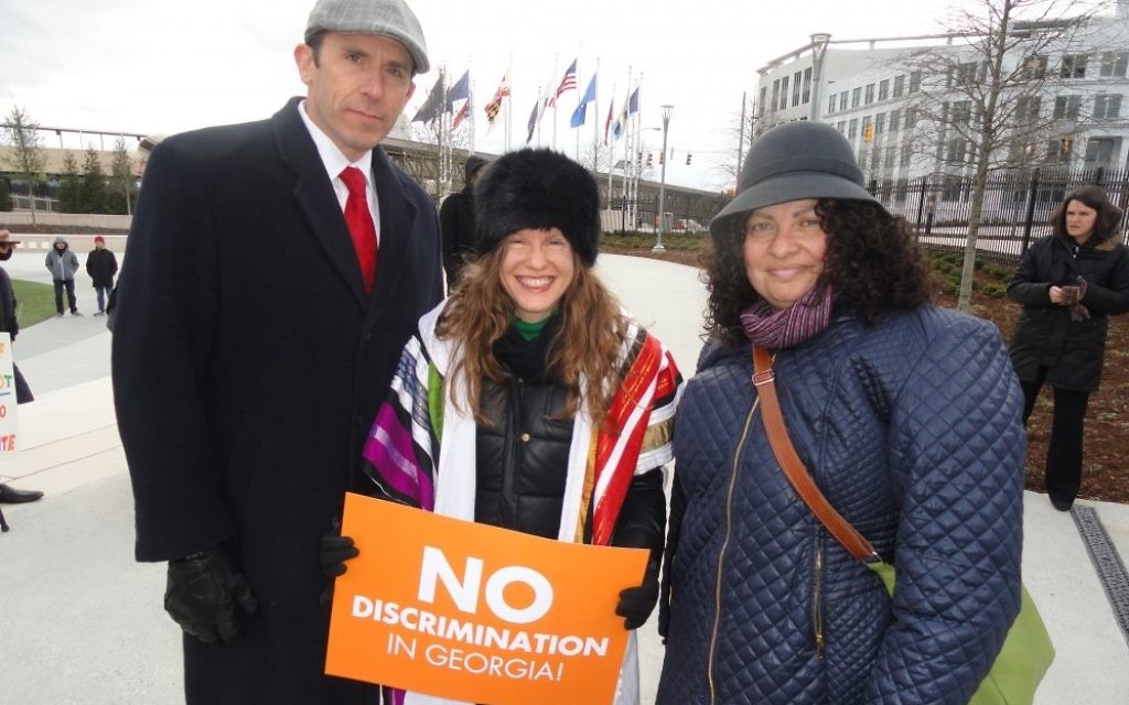 Rabbis David Spinrad, Malka Packer (center) and Ruth Abusch-Madger rally against the religious liberty bills Feb. 9.