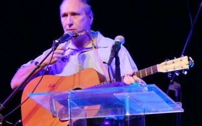 Rabbi Karmi Ingber, shown at KehillaFest, is a musician as well as an author.