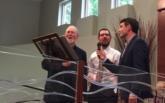 Dan Appelrouth sings with sons David and Jed at his annual hunger concert in 2015.