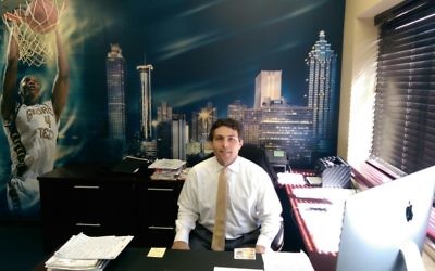Josh Pastner (pictured in his office) is flying solo at Georgia Tech until he hires assistant coaches. (Photo by David R. Cohen)