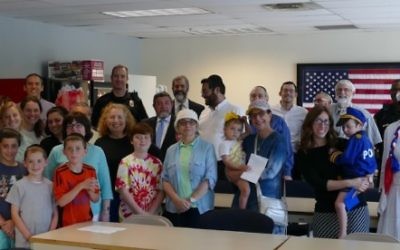 Members of the Toco Hills Jewish community make friends with the DeKalb police July 20.