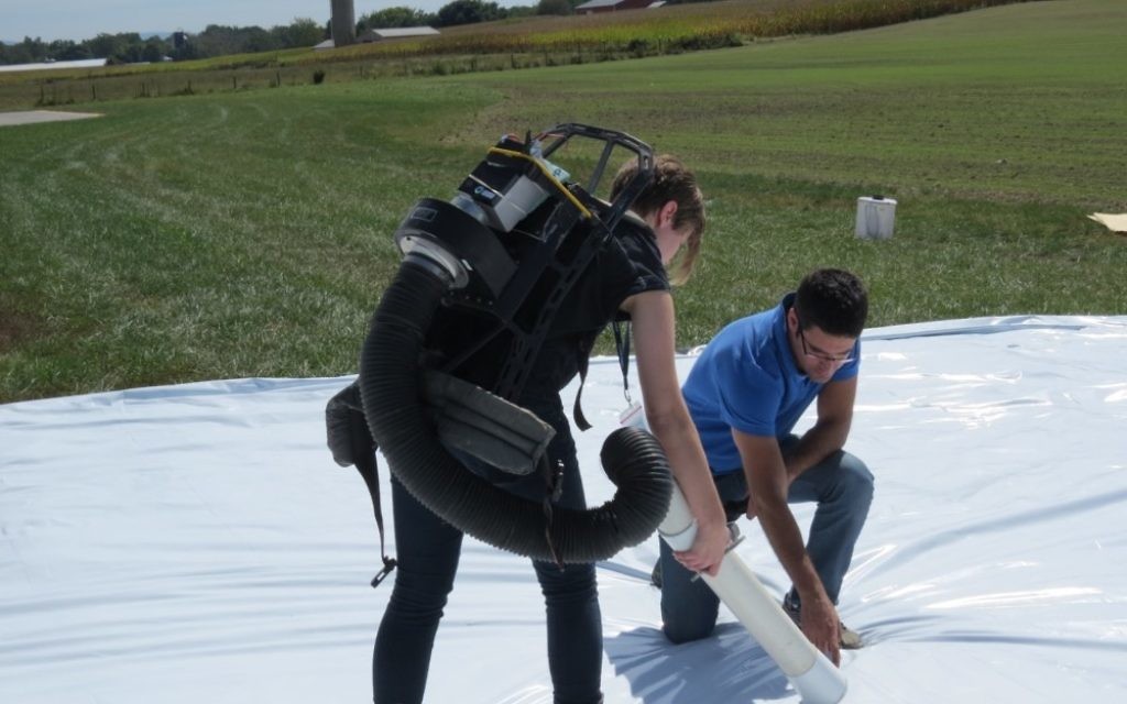 Senecio CEO Hanan Lepek helps a researcher collect the mosquitoes after the aerial test in September.
