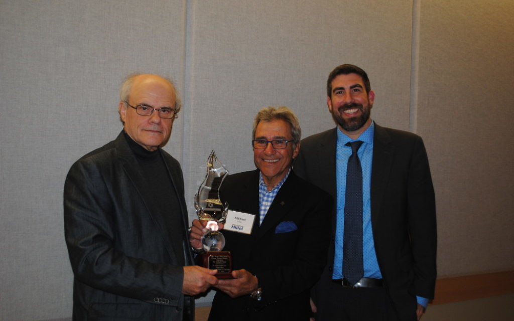Ken Stein accepts the Opher Aviran Award from Hillels of Georgia President Michael Coles (center) and Executive Director Russ Shulkes in the spring.