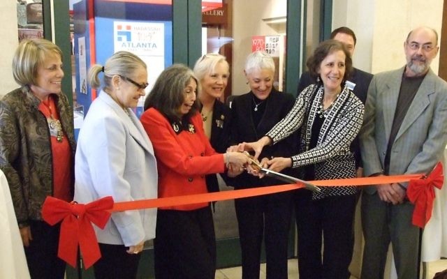Kicking off the yearlong centennial celebration Nov. 1, 2015, (center from left) centennial chair Phyllis Cohen, Greater Atlanta Hadassah President Paula Zucker, then-National President Marcie Natan and exhibition chair Ruthanne Warnick cut the ribbon on Hadassah Atlanta’s centennial exhibit at the Breman Museum. Joining the quartet in the middle are Southeastern Region President Toby Parker (left), Israeli Consul General Judith Varnai Shorer (scheduled to speak at the convention), Breman Executive Director Aaron Berger and exhibition display designer Dale Brubaker.