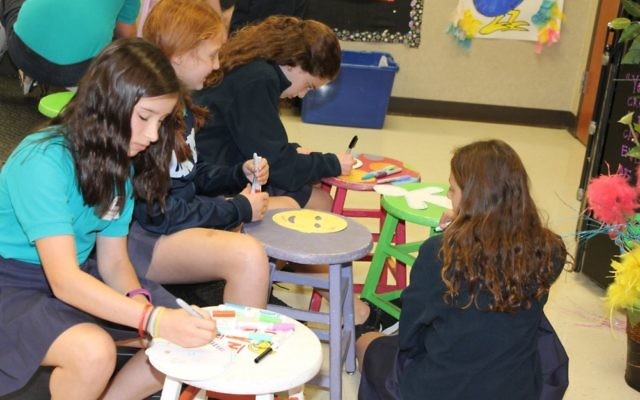Davis Academy Middle School students make masks, symbolic of the ones we all wear to hide our true identities.