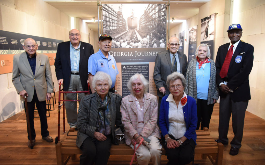 Nine of the 12 people featured in “Georgia Journeys” attend the opening reception Oct. 23: (from left) Herbert Kohn, Andre Kessler, Jimmy Doi, Tosia Schneider, Tooken Richardson Cade, Jane Tucker, Alton Cadenhead, Louvinia Jordan and Hillard Pouncy. (Photo courtesy of the Museum of History and Holocaust Education)