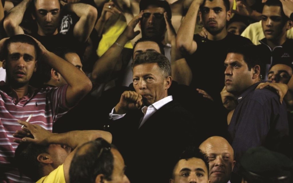 Beitar Jerusalem owner Arcadi Gaydamak stands among the fans during the drama of “Forever Pure,” playing Jan. 29 and 31 and Feb. 11.