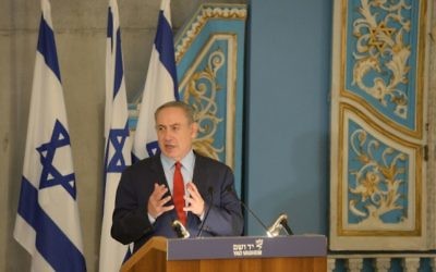 Israeli Prime Minister Benjamin Netanyahu speaks at a Yad Vashem commemoration Jan. 26. (Photo by Amos Ben-Gershom, Government Press Office)