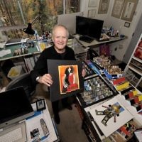 Paul Muldawer makes good use of his lower-level workshop, where he stores no fewer than 13,000 photos for future projects.