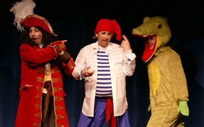 The Crocodile (Annalise Hardy) sneaks up on Captain Hook (Darren Rosing) and Smee (Matthew Szabo).