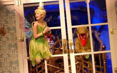 Tinker Bell (Brooke Ross) and the Crocodile (Annalise Hardy) enjoy the Darling family reunion.