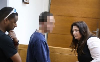 The Israeli teen accused of making bomb threats against dozens of Jewish community centers appears in Rishon Lezion Magistrate's Court on March 23.