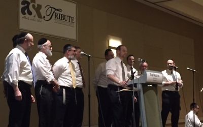 Atlanta Scholars Kollel rabbis perform the chorus of “Teach Us a Song” to the tune of Billy Joel’s “Piano Man.”