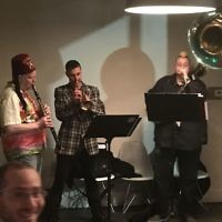 A jazz band provides the music for the YJP Purim party.