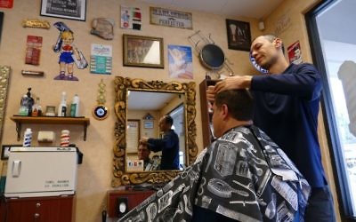 Yury Abramov honed his skills in New York before opening Vintage Barbershop in Sandy Springs in 2012.