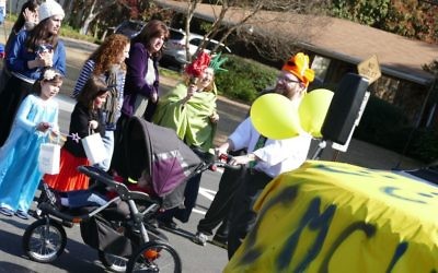 Chaya Mushka Children's House has a prominent, yellow presence at the Purim Parade on March 5, 2017.