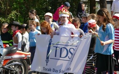 Torah Day School students show their school pride at the 2017 Purim Parade.